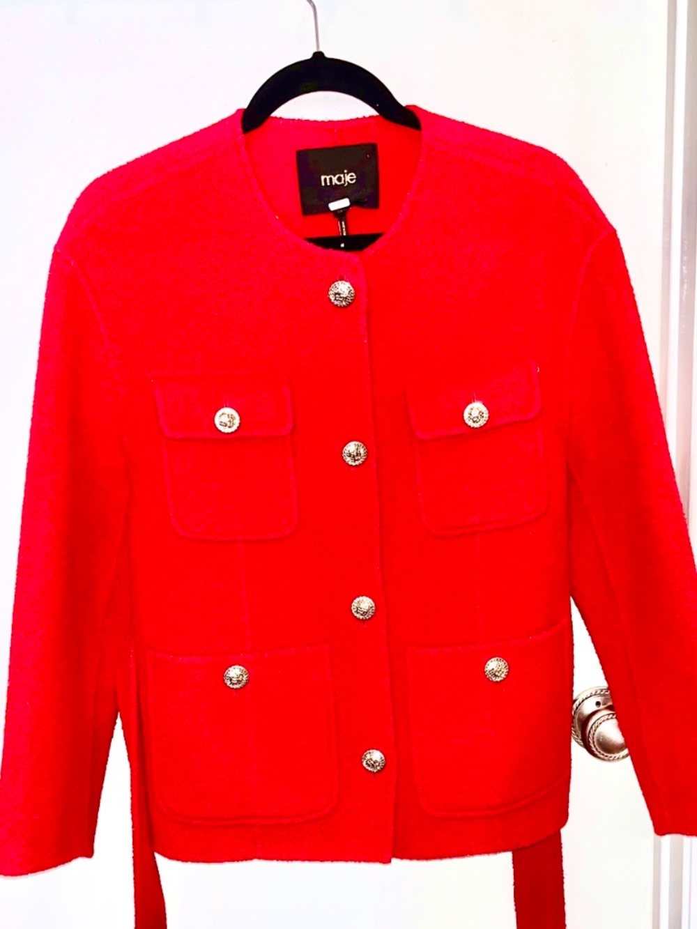 European fashion is apparent in this pre-loved red belted Jacket/Blazer